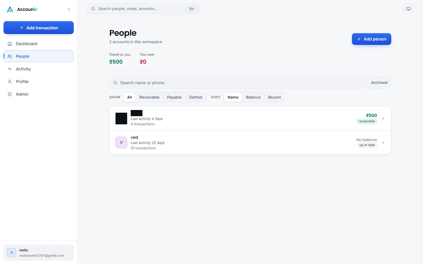 Accounic people list with one account's name redacted, showing a receivable balance and an account that is up to date.
